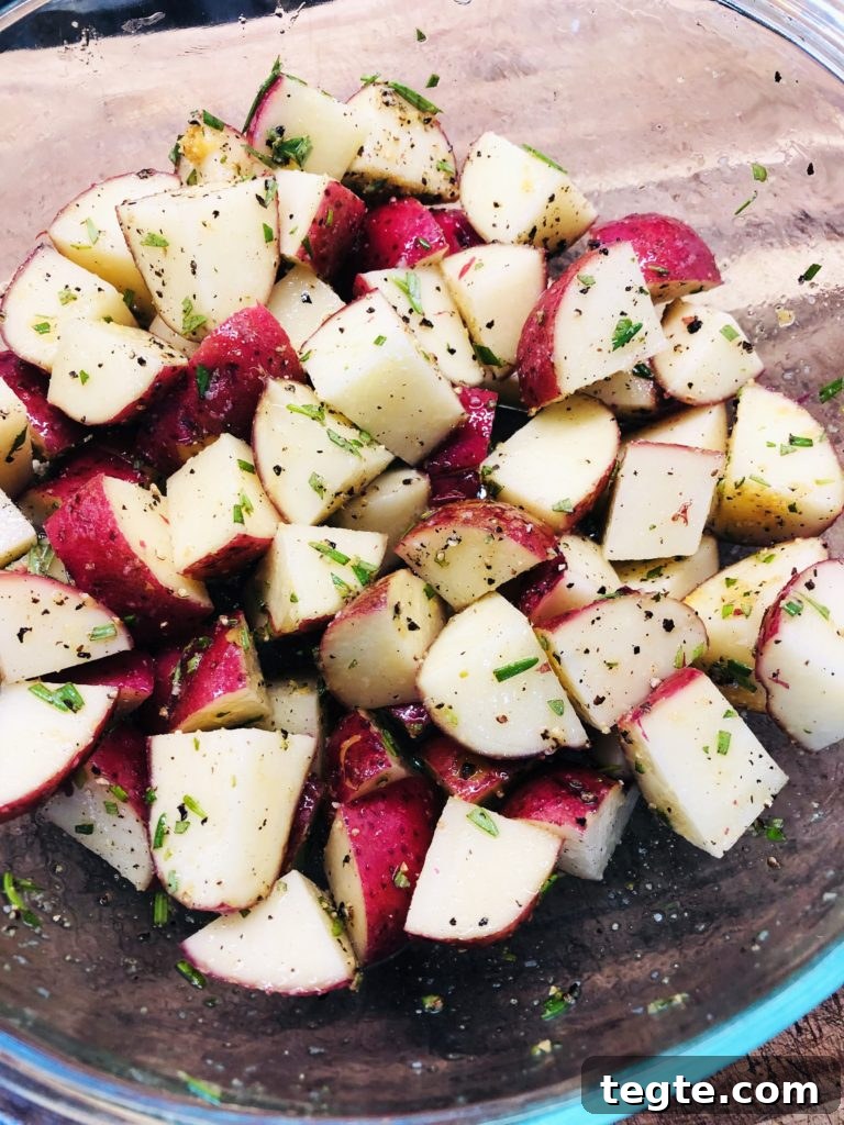Crispy Air Fryer Garlic and Rosemary Potatoes 3 diced potato with seasonings