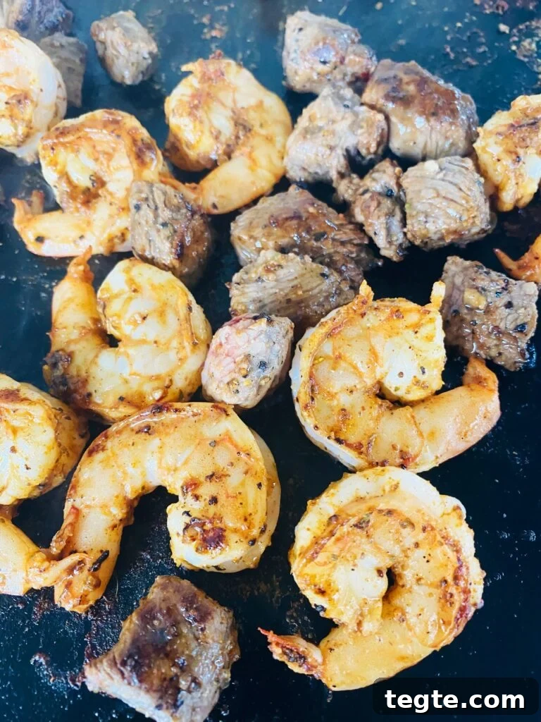 Blackstone Surf-and-Turf Quesadillas: Steak & Shrimp Grilled on a Flat Top 7 shrimp and steak cooking on the griddle
