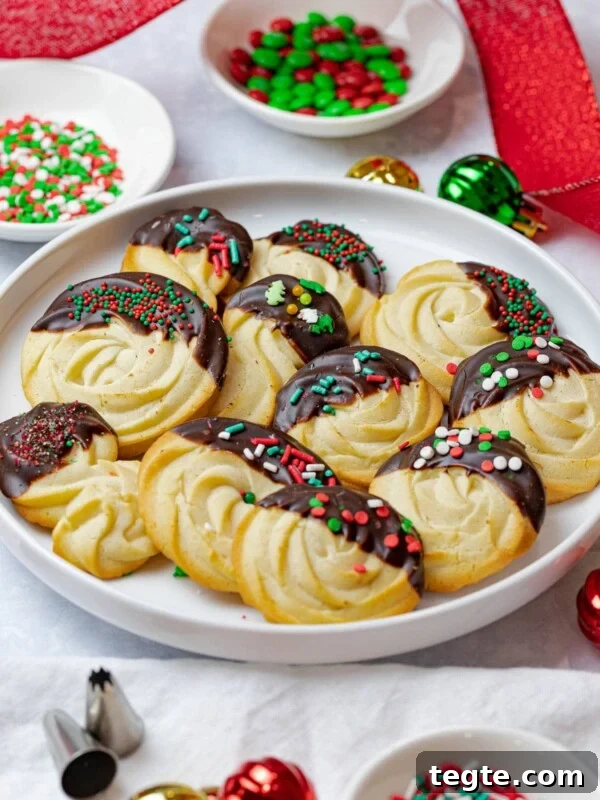 Authentic Japanese Strawberry Shortcake Recipe — Fluffy, Light Slice 16 Christmas butter cookies dipped in chocolate and decorated with sprinkles surrounded by holiday decorations and red ribbon