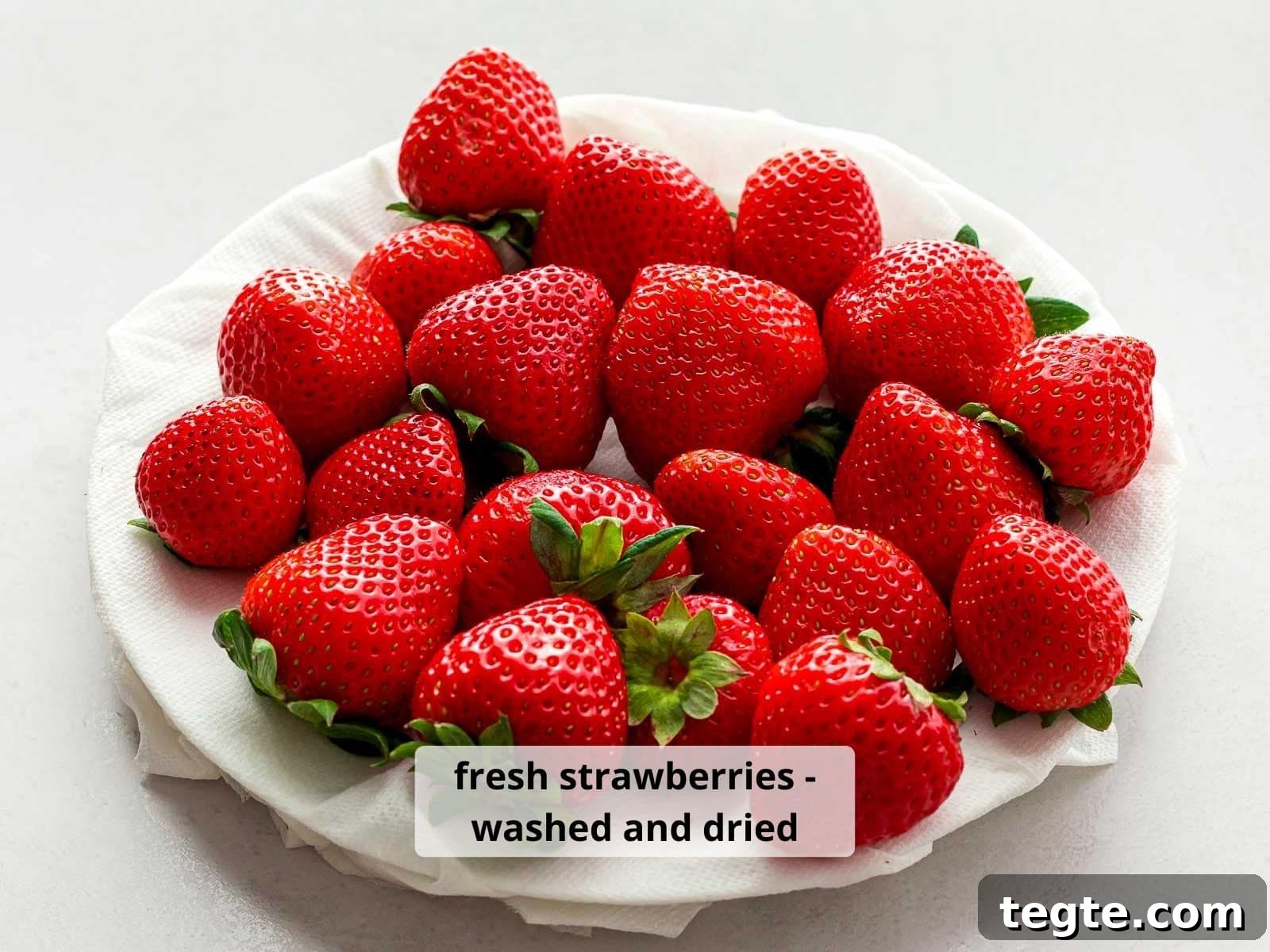 Authentic Japanese Strawberry Shortcake Recipe — Fluffy, Light Slice 7 close up of red strawberries washed and dried on a white plate