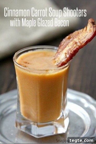 carrot soup shooter in shot glass with strip of bacon