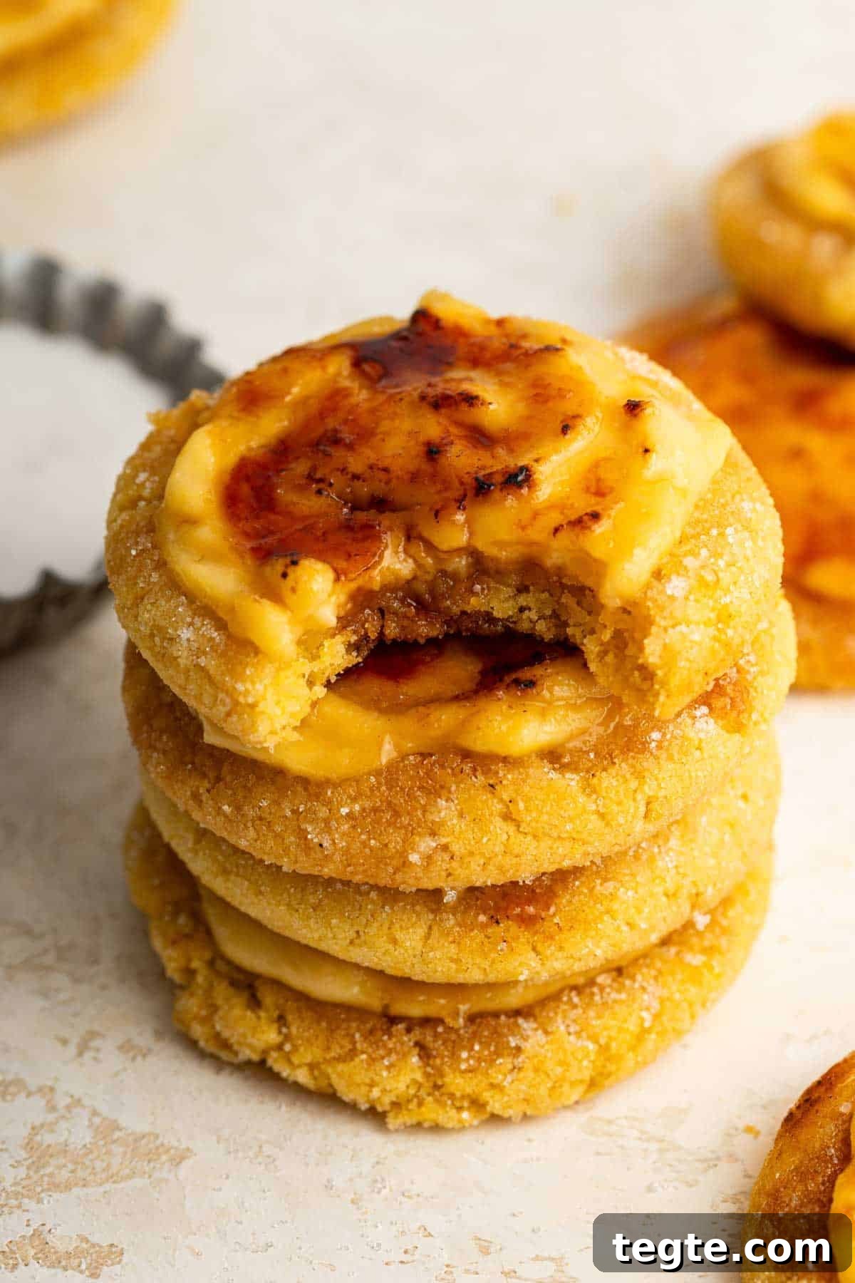 Crème Brûlée Cookies Recipe: Caramelized Sugar-Topped Cookie Treat 3 Stack of creme brulee cookies with bite missing from top cookie.