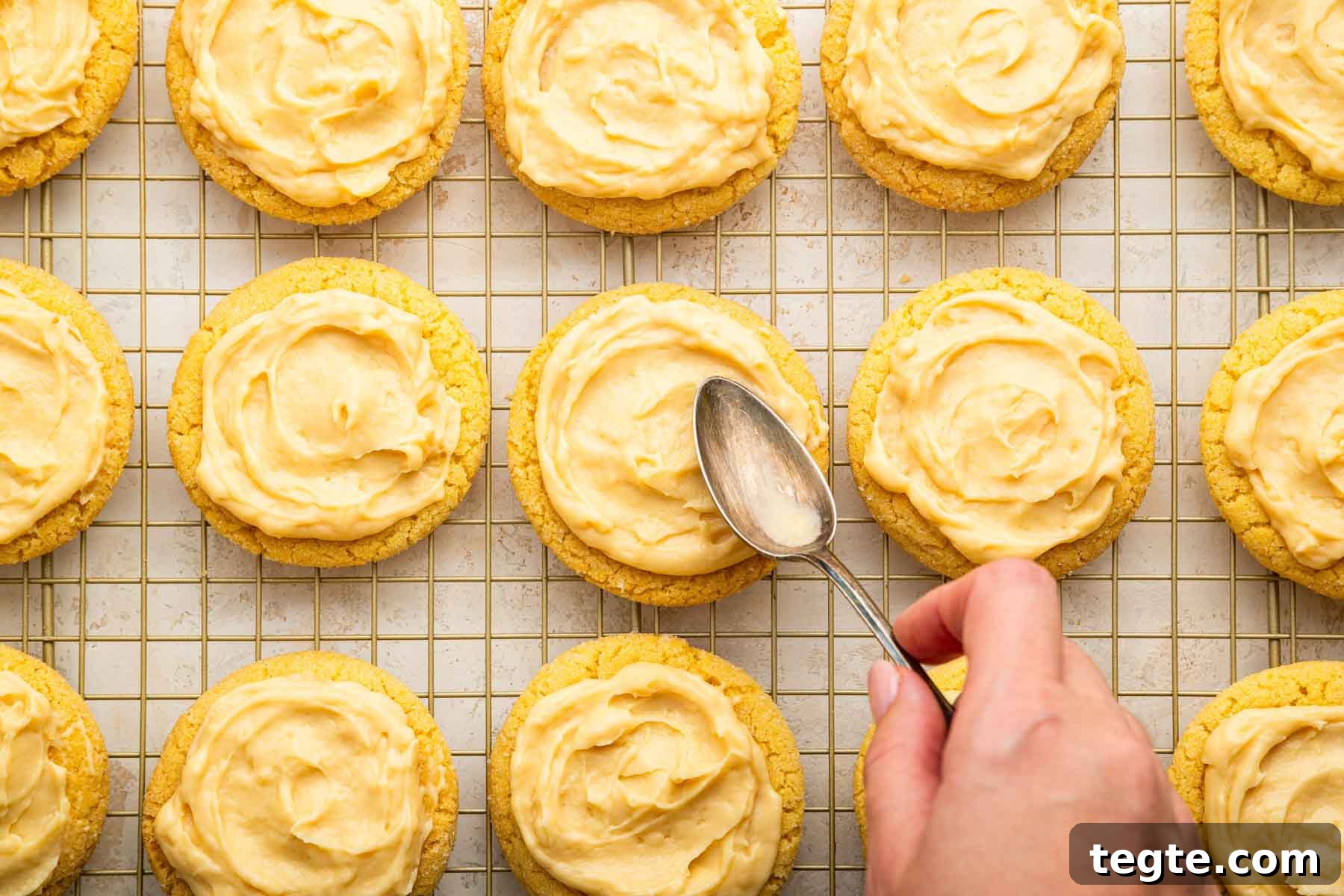 Crème Brûlée Cookies Recipe: Caramelized Sugar-Topped Cookie Treat 10 Hand spreading pudding on top of cookies.