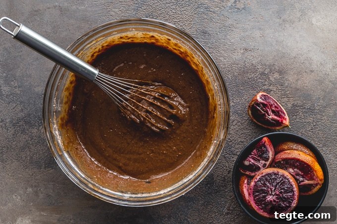 Dairy-Free Blood Orange Chocolate Cake Recipe 5 Blood orange cake batter in a glass bowl.
