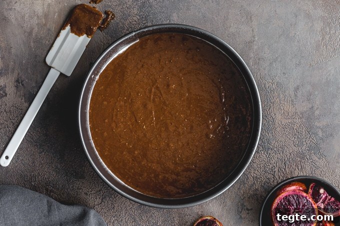 Dairy-Free Blood Orange Chocolate Cake Recipe 6 Chocolate cake batter poured into a springform pan.