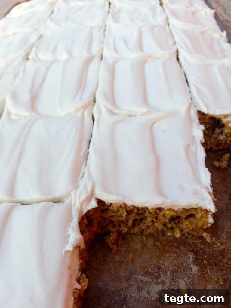Zucchini Bars with Cream Cheese Frosting Recipe for Moist Dessert 5 frosted zucchini bars cut into squares.