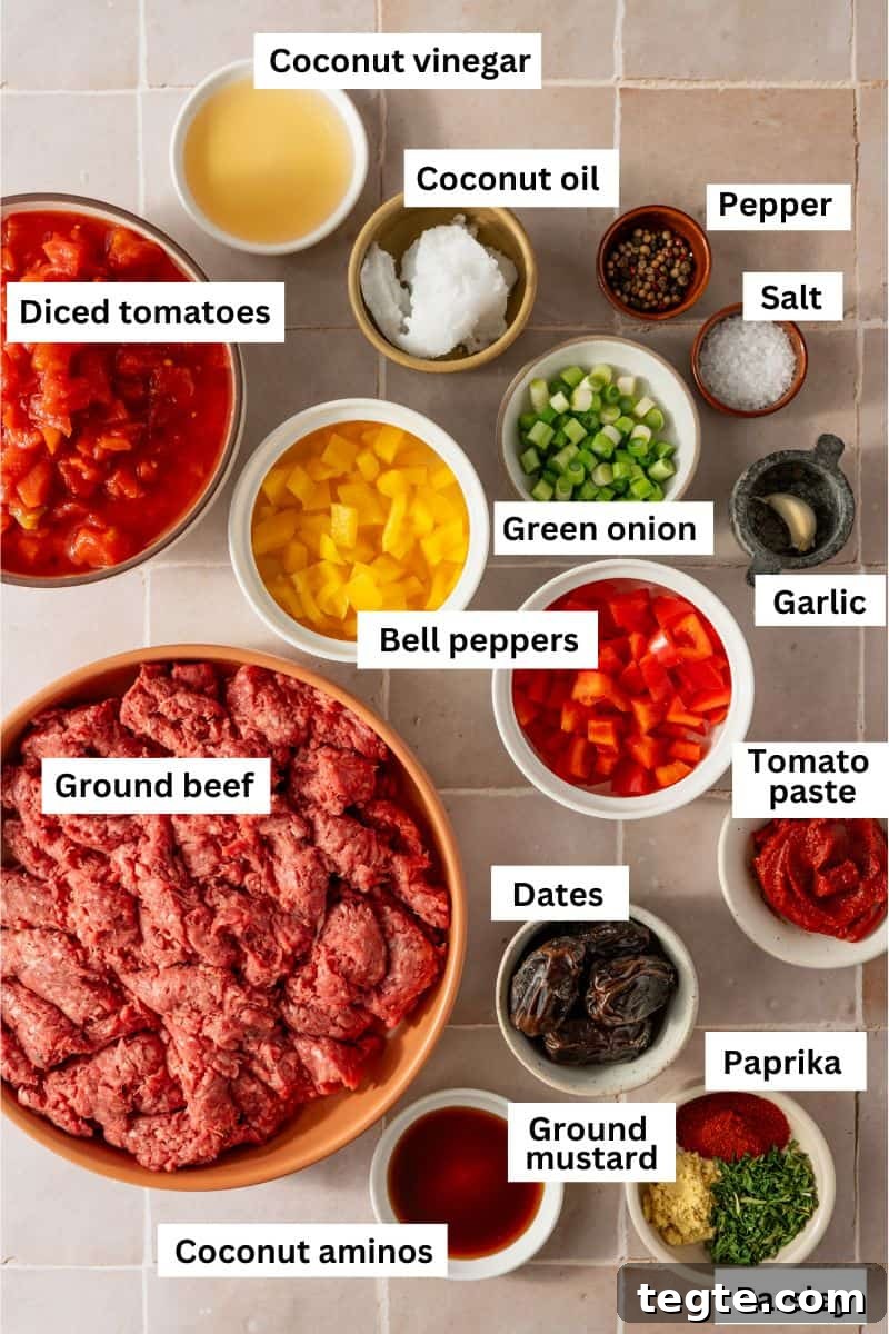 Lean Ground Beef Sloppy Joes with Tangy Tomato Sauce 3 The ingredients needed for making sloppy Joes separated into bowls including ground beef, diced tomatoes, bell peppers, spices, vinegar and dates.
