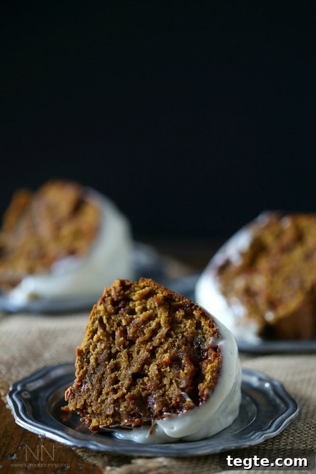 Butterscotch Pumpkin Bundt Cake slice Butterscotch Pumpkin Bundt Cake slice served on a small plate.