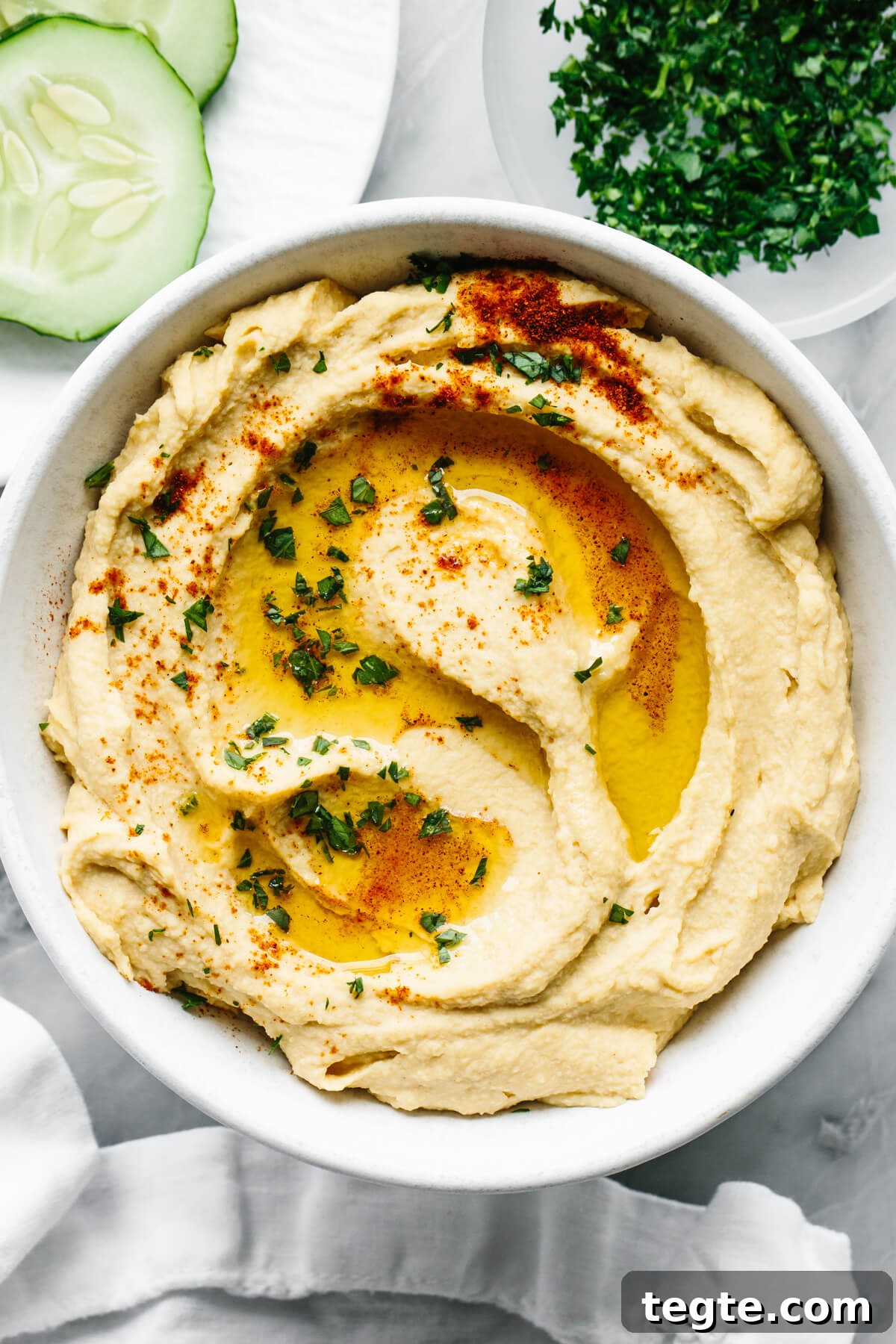 13 Festive Christmas Appetizers Your Guests Will Love 12 A bowl of homemade hummus next to a napkin