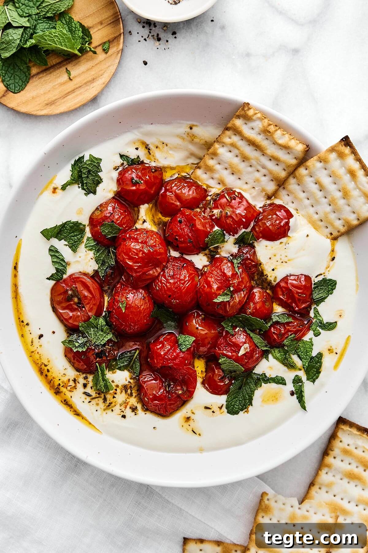 13 Festive Christmas Appetizers Your Guests Will Love 15 A bowl of whipped feta with roasted tomatoes.