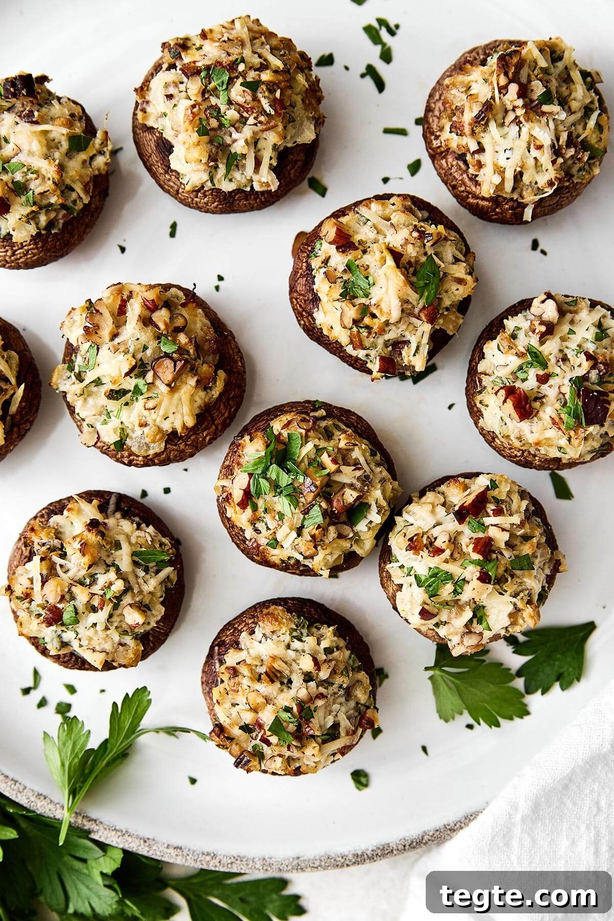 13 Festive Christmas Appetizers Your Guests Will Love 3 A plate of stuffed mushrooms.