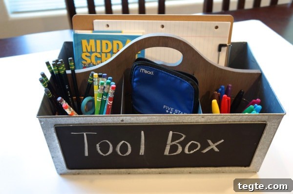 Homework Toolbox: Organize School Supplies for Students 7 Colorful school supplies organized in a metal toolbox labeled "Tool Box" on a table.