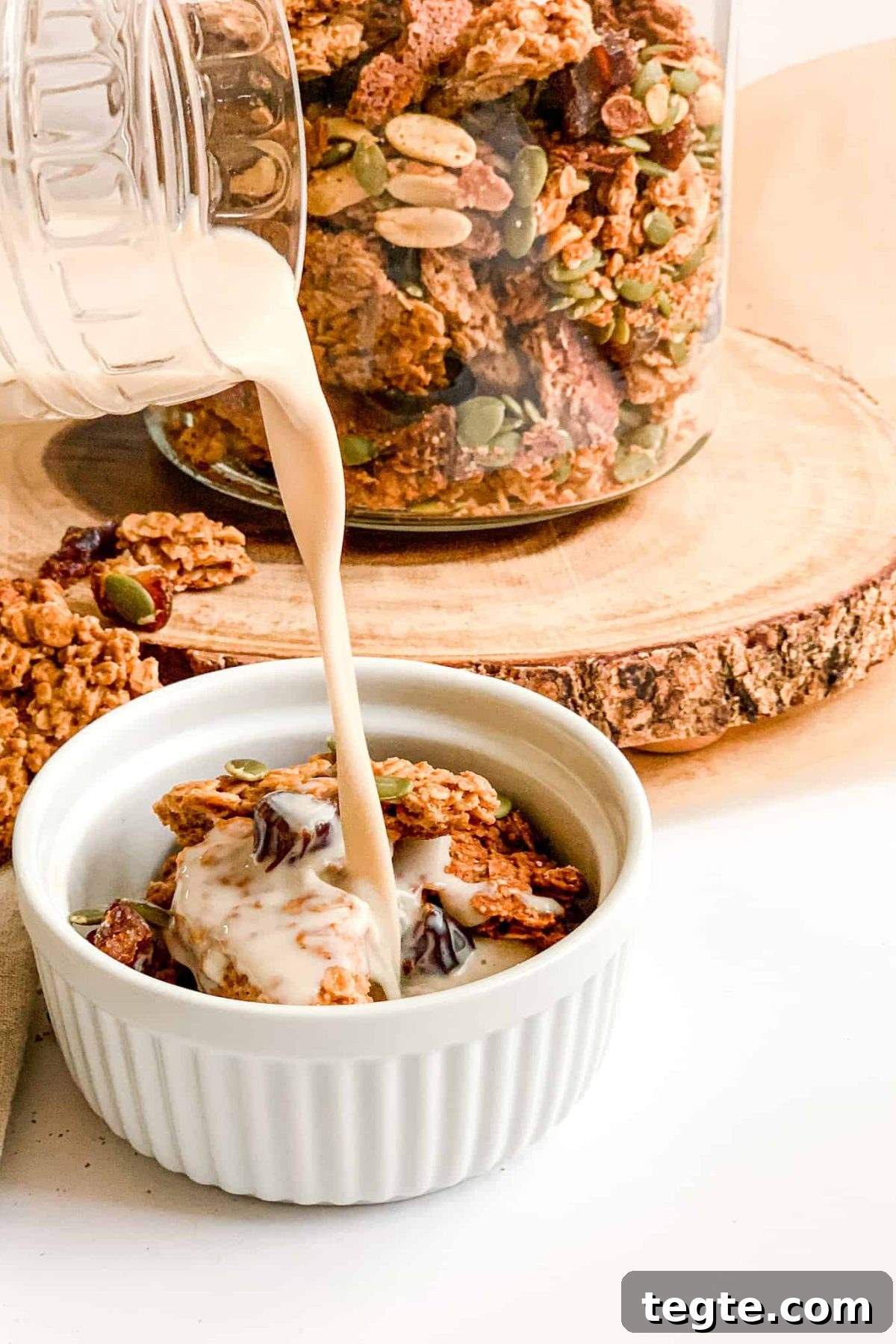 Peanut Butter Granola Pouring Milk into a Bowl of Healthy Crunchy Homemade Granola for Breakfast, Food Photography for Food Blog