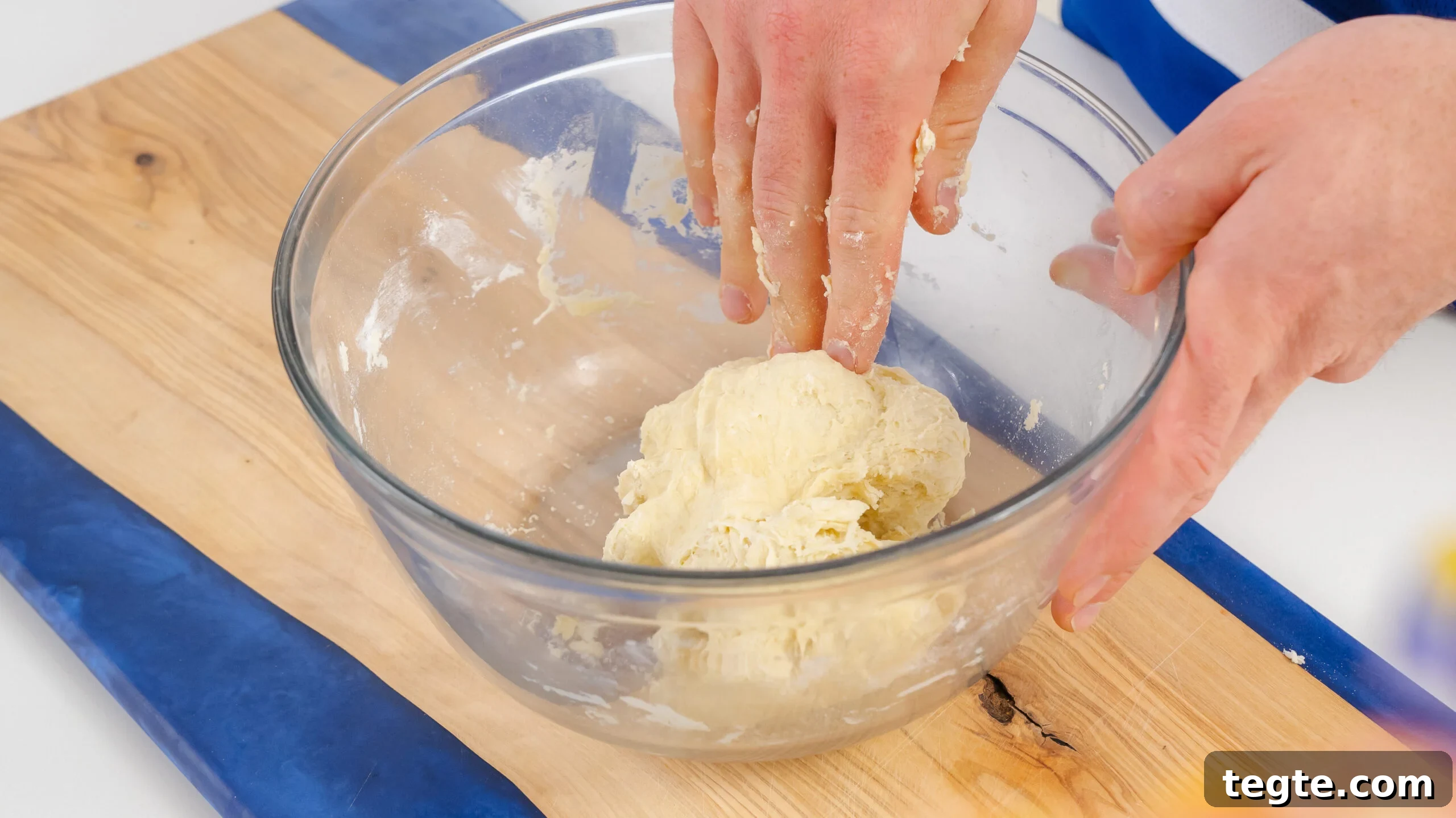 Homemade Flour Tortillas Made with 5 Simple Ingredients 3 Shaggy dough in a bowl being mixed for homemade flour tortillas.
