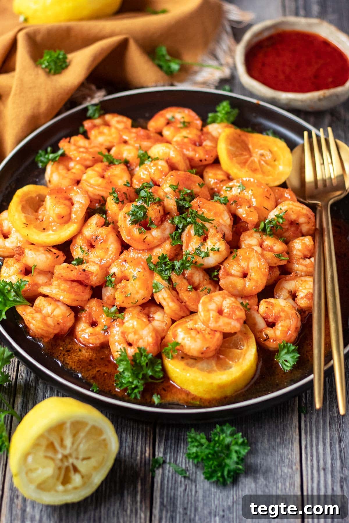 cajun honey butter shrimp on black plate
