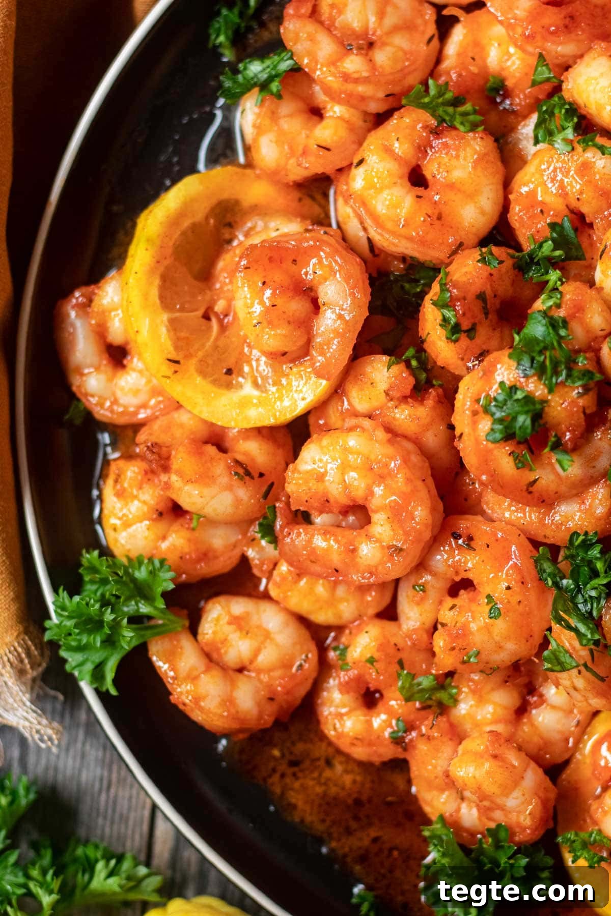 cajun honey butter shrimp on black plate