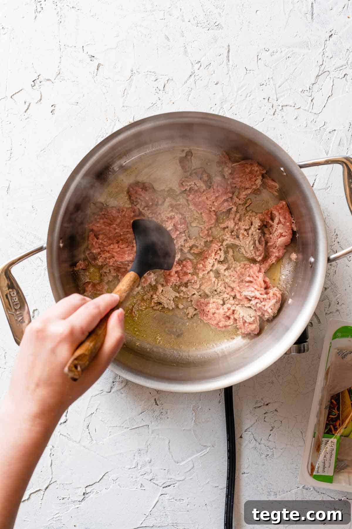 ground turkey being browned in soup pot