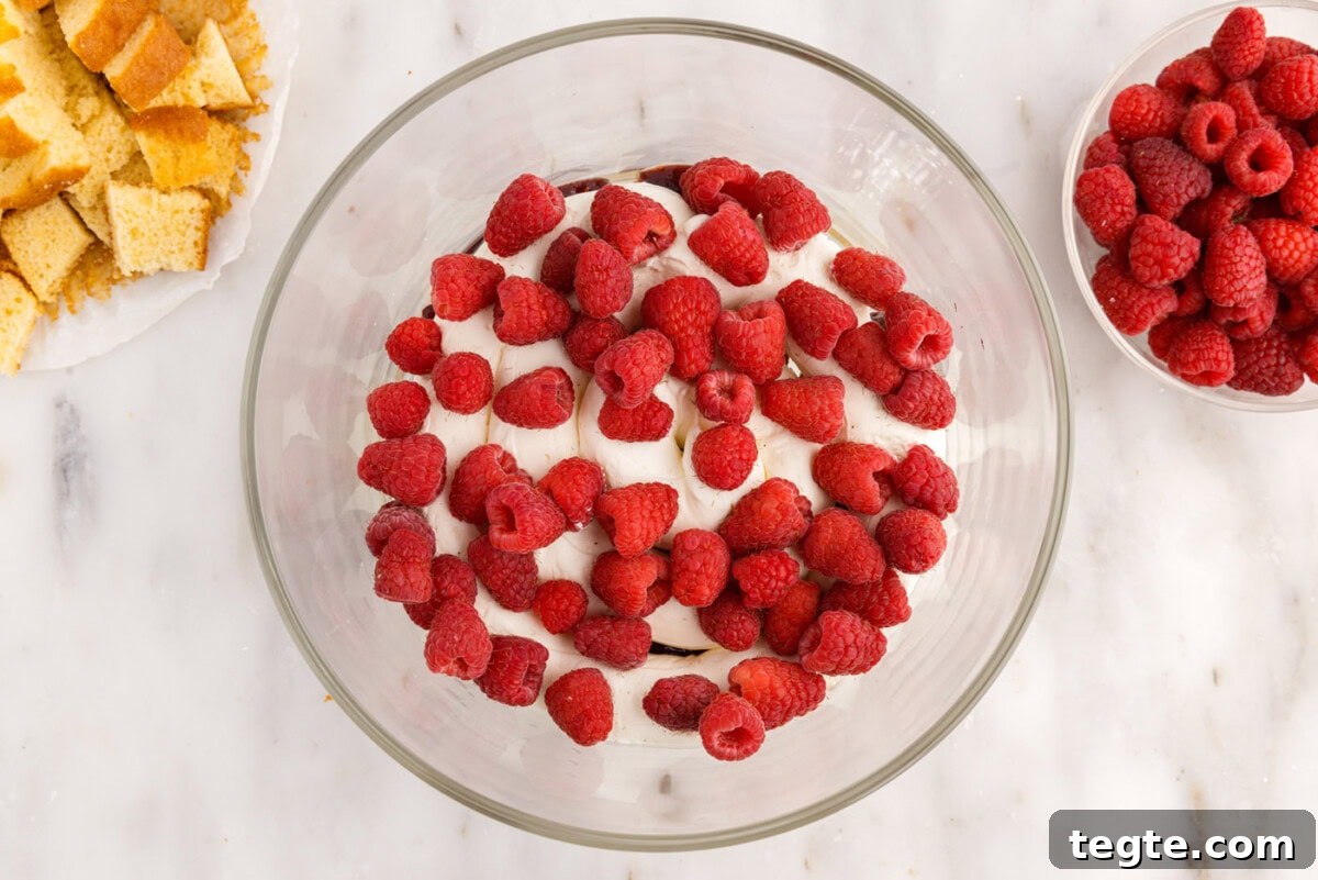 Decadent Raspberry Trifle Recipe with Fresh Cream and Cake 14 fresh raspberries added on top of cream cheese mixture