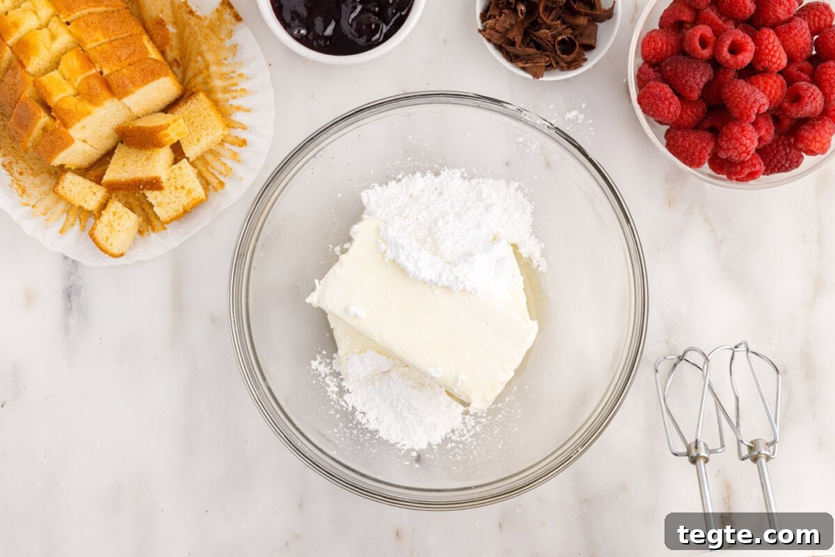Decadent Raspberry Trifle Recipe with Fresh Cream and Cake 5 cream cheese, lemon juice, and powdered sugar in a mixing bowl