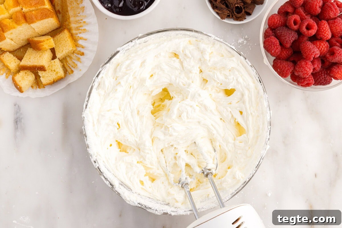 Decadent Raspberry Trifle Recipe with Fresh Cream and Cake 10 mixer incorporating whipped cream with cream cheese