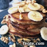 Fluffy Banana Bread Pancakes with Cinnamon and Maple Syrup 13 Stack of Banana Bread Pancakes on a blue plate