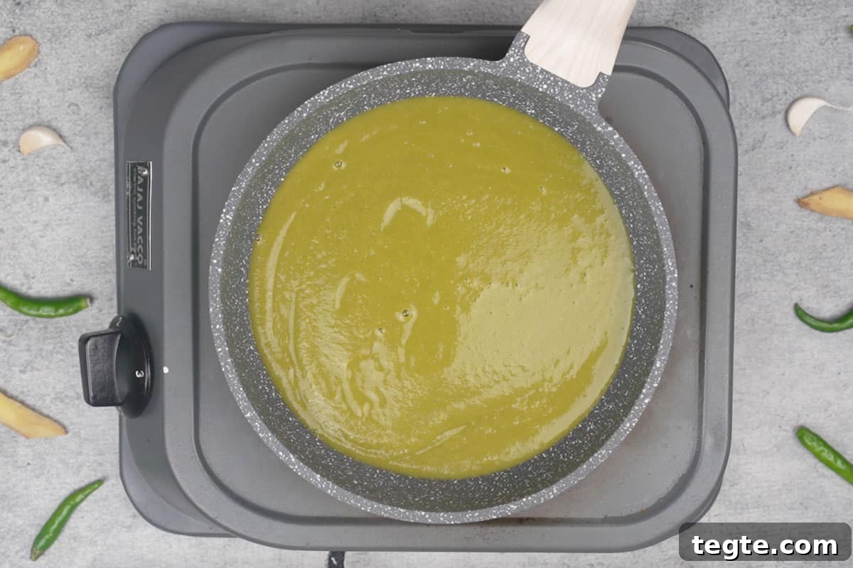 Indo-Chinese Green Chili Sauce Recipe for Spicy Dips and Stir-Fries 6 Mixture transferred to a pan.