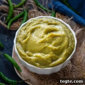 Indo-Chinese Green Chili Sauce Recipe for Spicy Dips and Stir-Fries 12 A white bowl filled with smooth Green Chilli Sauce