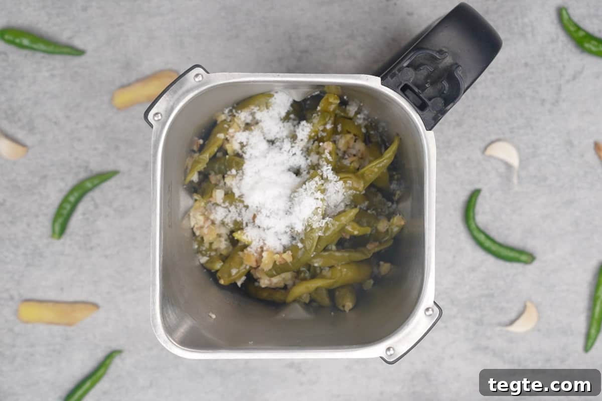Indo-Chinese Green Chili Sauce Recipe for Spicy Dips and Stir-Fries 4 Cooked chilies added to a blender along with vinegar, salt and sugar.