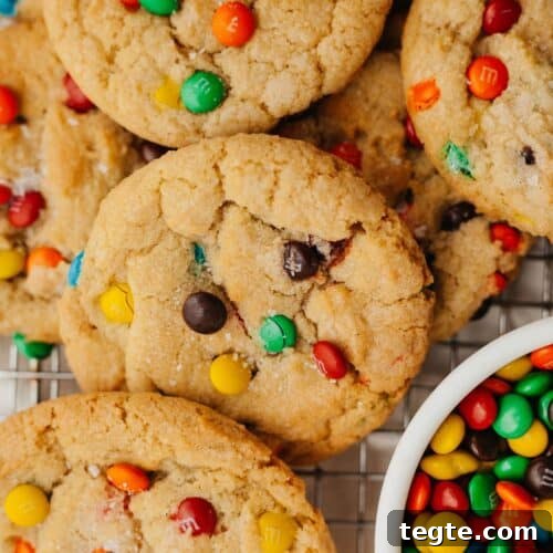 rainbow mini m&m cookies with a small bowl of mini m&ms