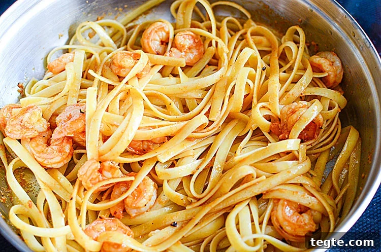 Bang Bang Shrimp Pasta Recipe – Creamy Spicy Shrimp Linguine 7 Shrimp and pasta tossed in pan
