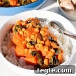 Side shot of curry served in a bowl with rice.