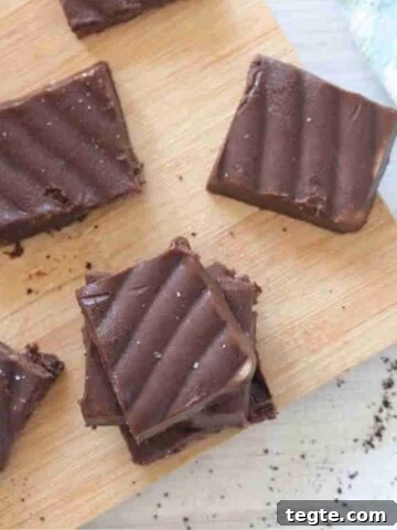 Squares of coffee fudge on a cutting board.