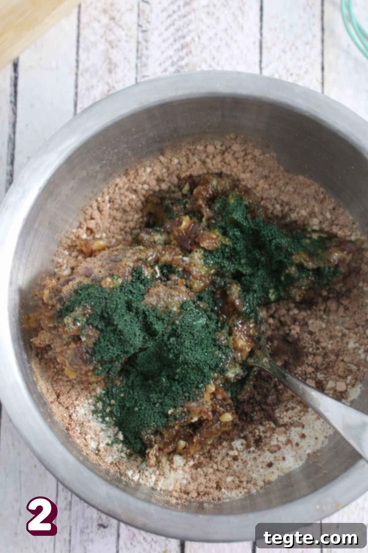 Energizing Spirulina Protein Balls (Gluten-Free) 5 Spirulina energy ball mixture in a steel bowl.