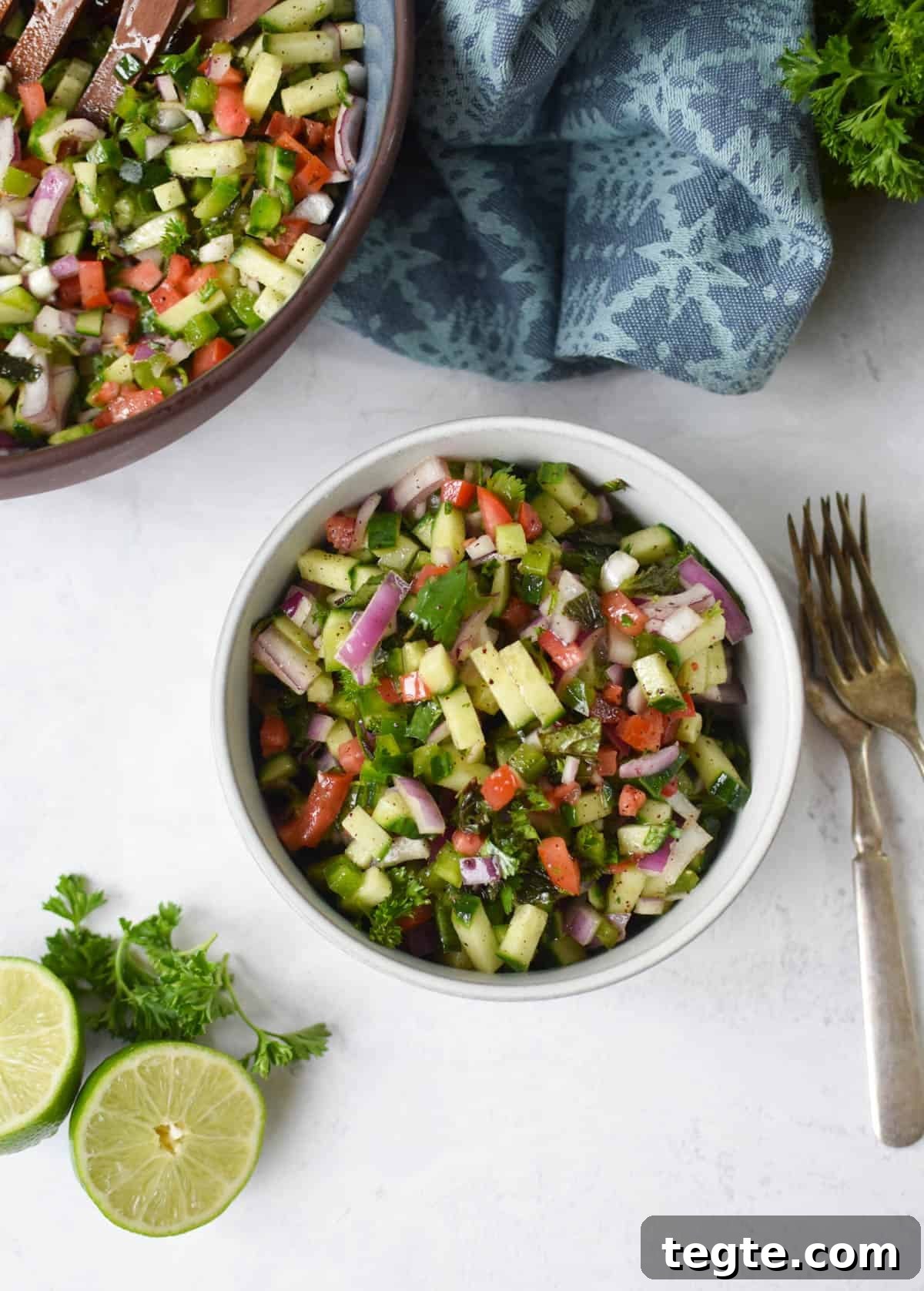 Authentic Shirazi Salad Recipe: Crisp Persian Cucumber Tomato Salad 8 Shirazi Salad Recipe in white bowl with forks.