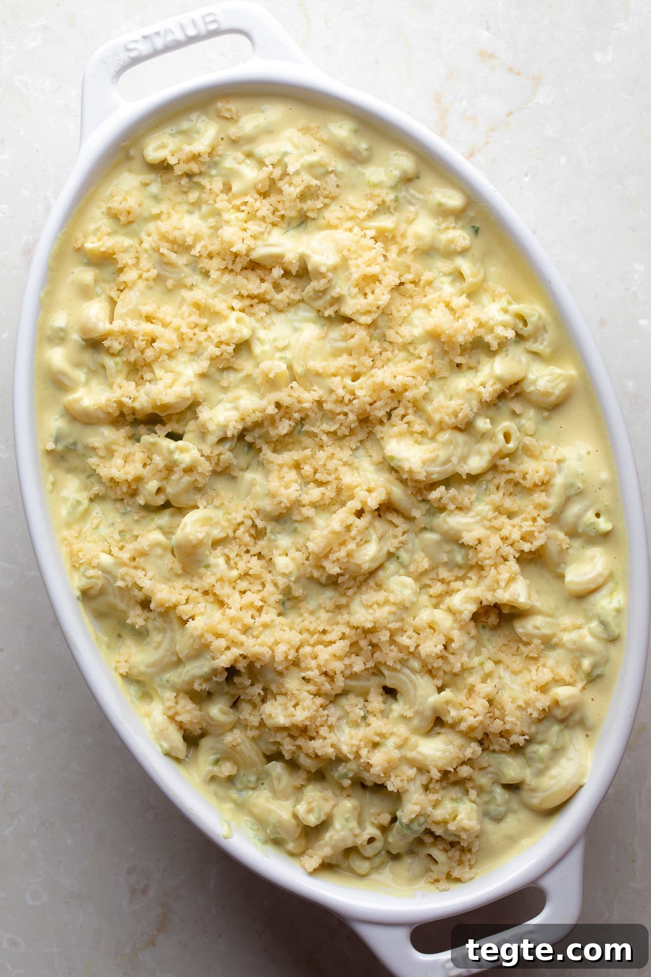 Creamy Vegan Jalapeño Mac and Cheese Recipe 7 overhead view of unbaked Vegan Jalapeño Mac and Cheese in a casserole dish.
