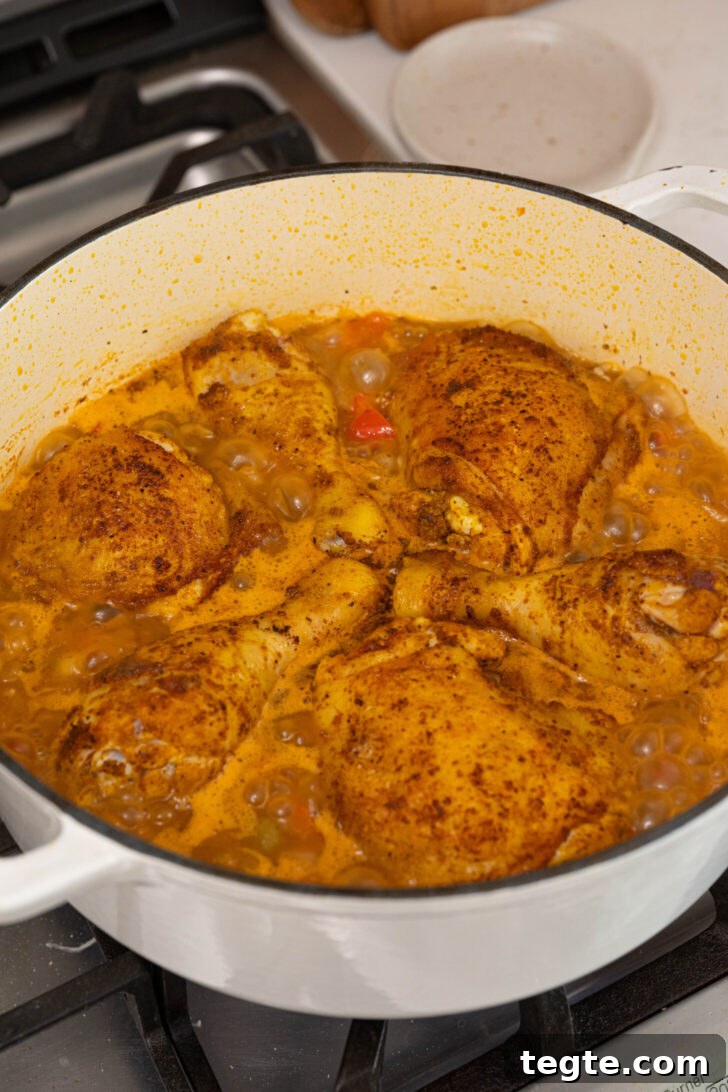 Authentic Puerto Rican Arroz con Pollo Recipe: Traditional Flavor Guide 9 Arroz con pollo cooking in a pot.