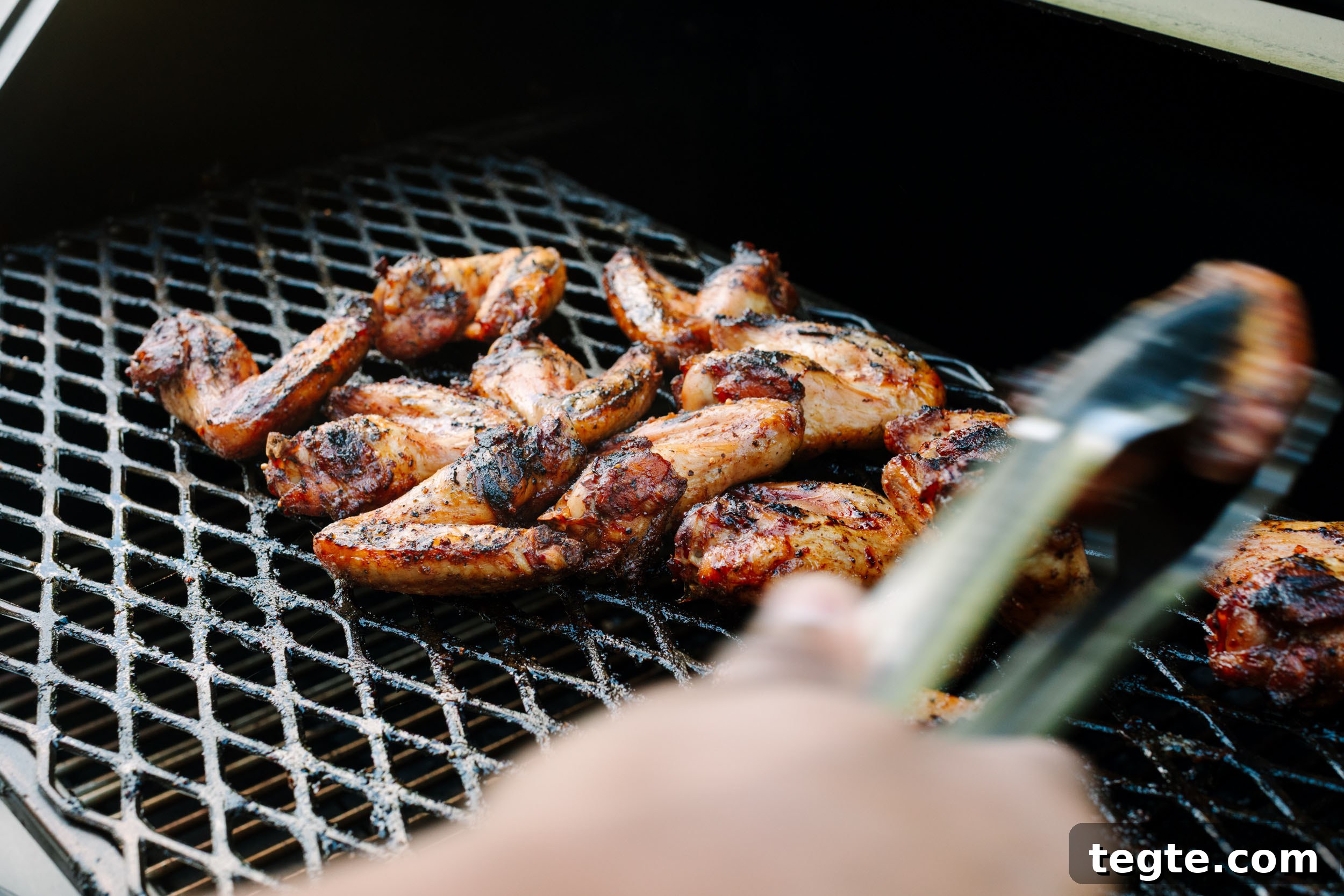 Asian Chili Garlic Chicken Wings Recipe 13 Asian chicken wings on a smoker.