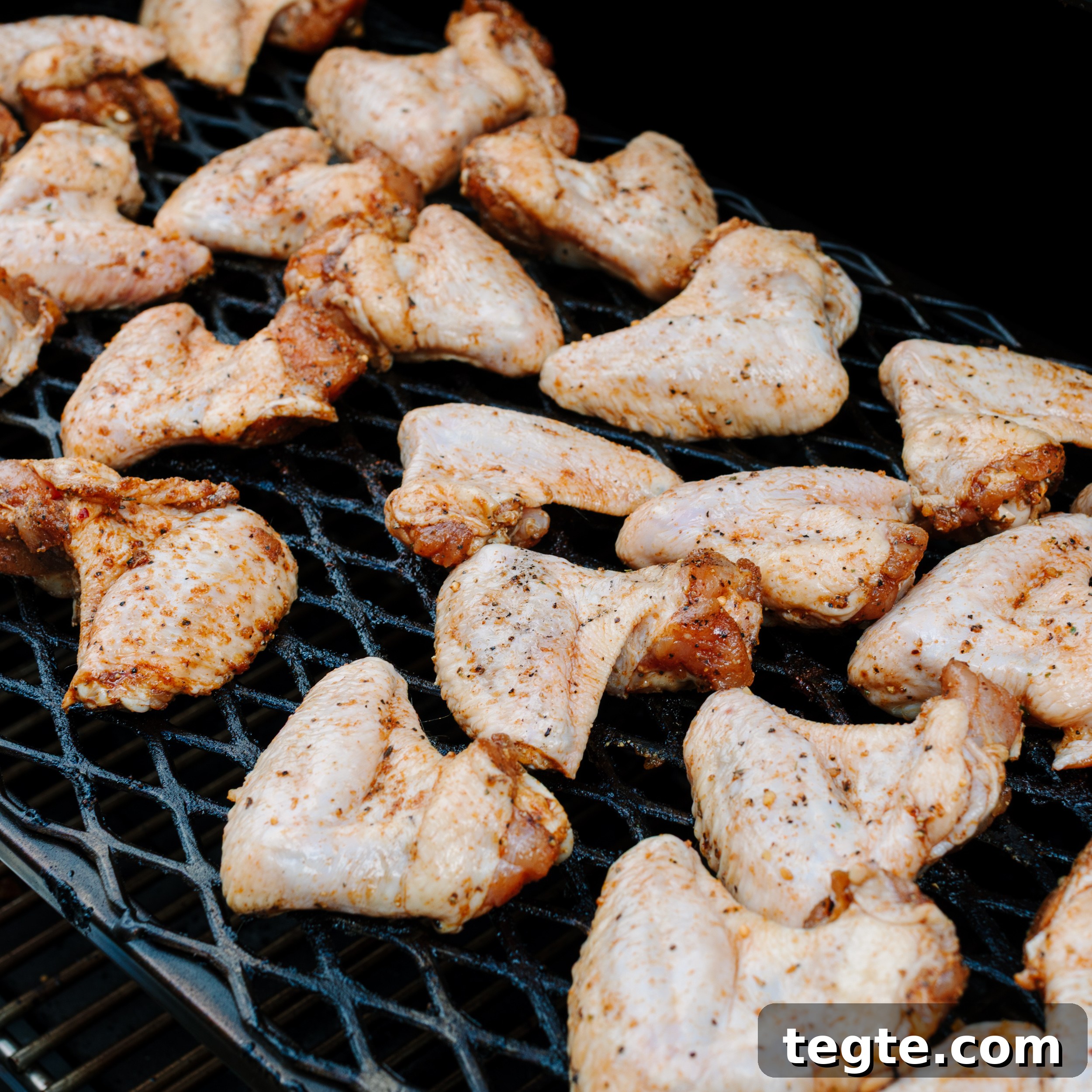 Asian Chili Garlic Chicken Wings Recipe 5 Raw chicken wings on a smoker.