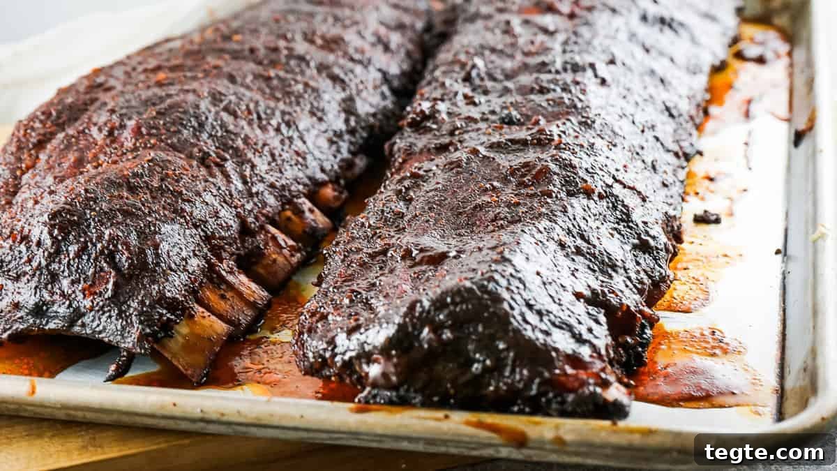 Sheet pan with spicy smoked ribs on it